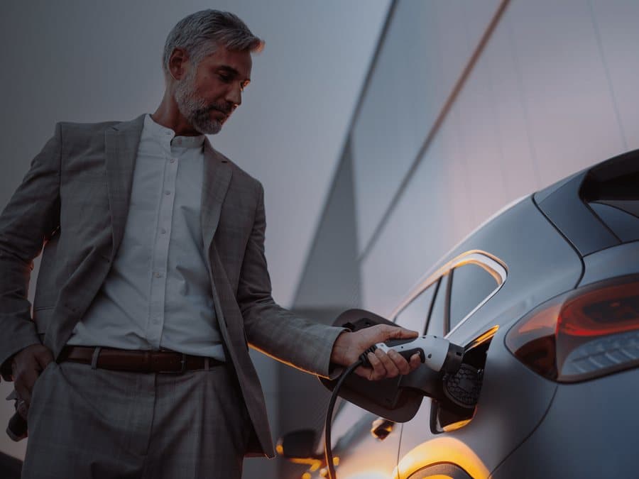 A PCO private hire driver charging their electric car